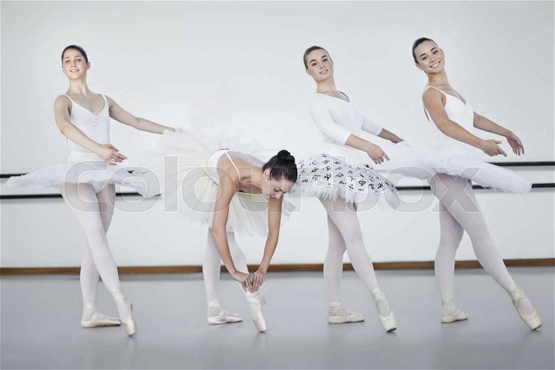 Ballet dancers standing in studio, stock photo