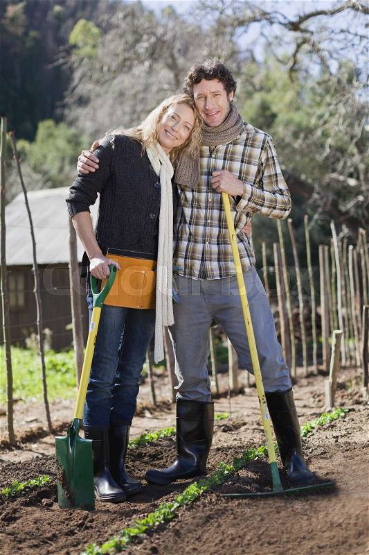 Couple gardening together, stock photo