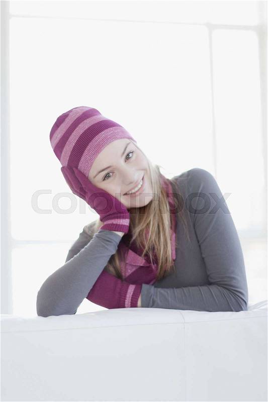 Teenage girl wearing hat and gloves, stock photo