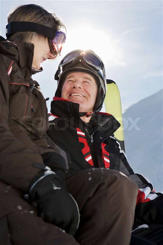 Mature couple in ski-wear, stock photo