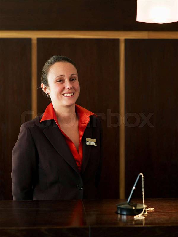 Young female hotel receptionist, stock photo