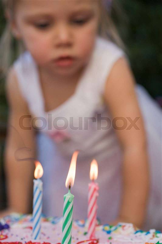 Girl and birthday candles, stock photo