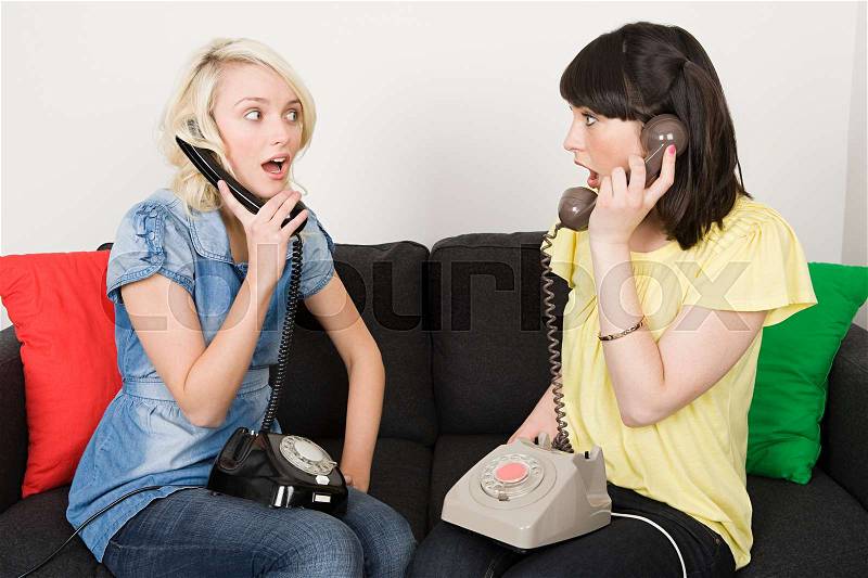 Two women having telephone conversations, stock photo
