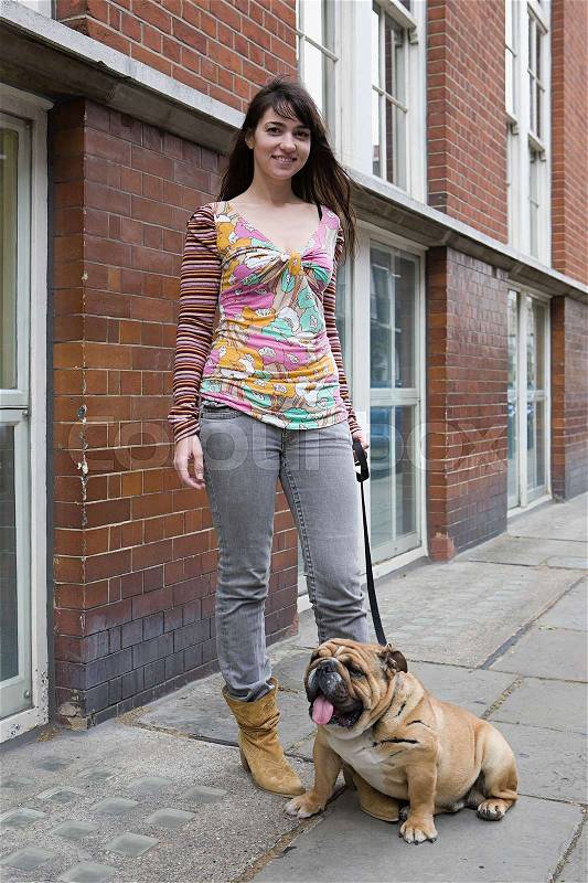Woman and pet bulldog, stock photo