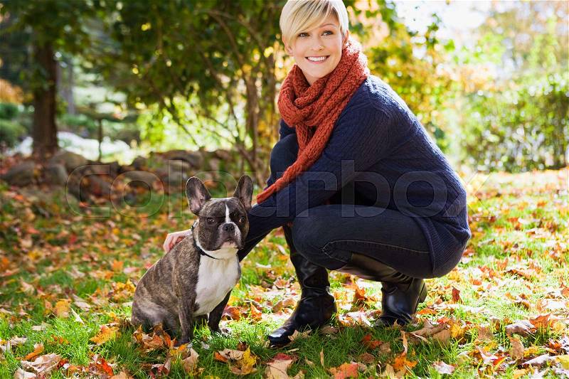 Young woman with pet dog, stock photo