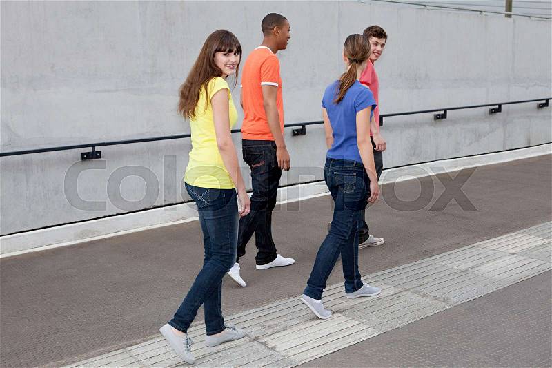 Young people walking, stock photo