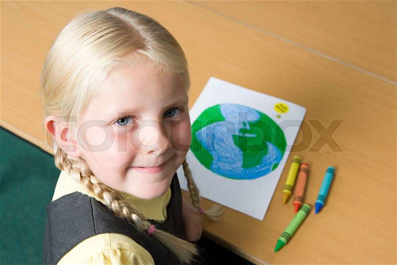 Girl drawing planet earth, stock photo