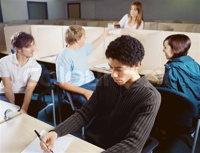 Teenagers studying and chatting, stock photo