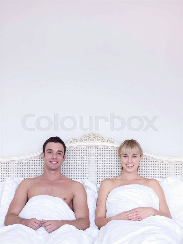 Man and woman in bed, stock photo