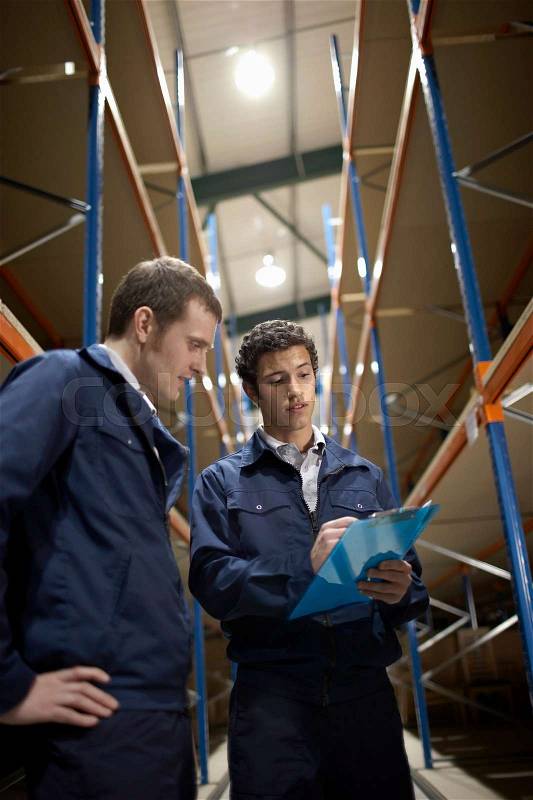 Two workers in warehouse, stock photo
