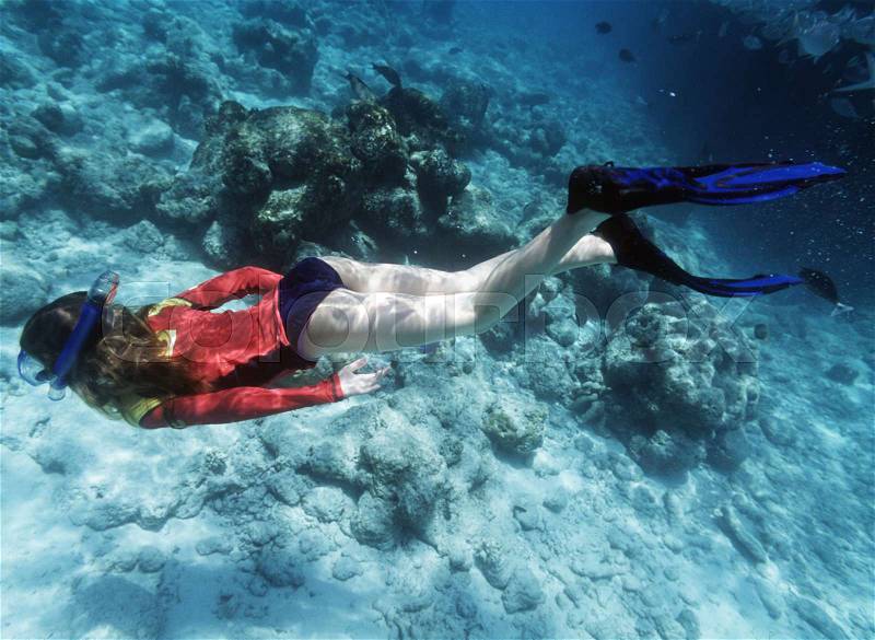 Underwater shot of girl snorkeling, stock photo