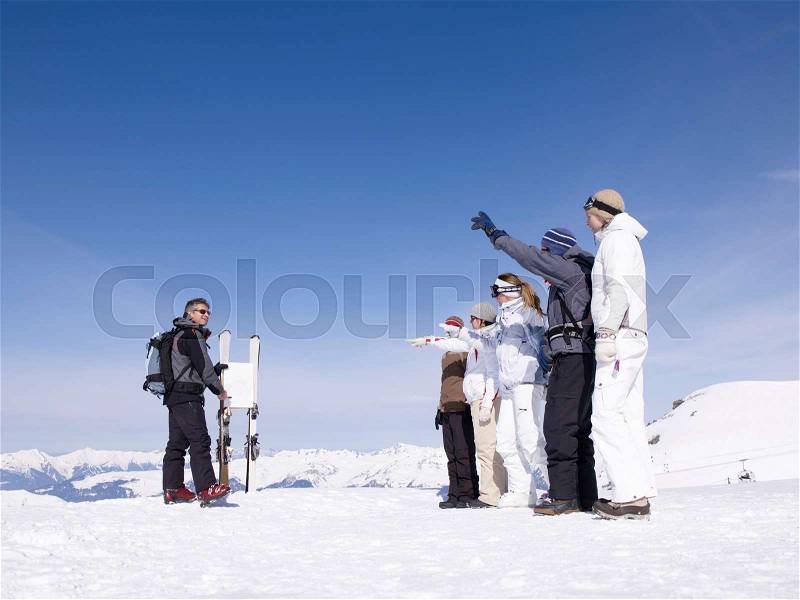 Ski instructor teaching class, stock photo