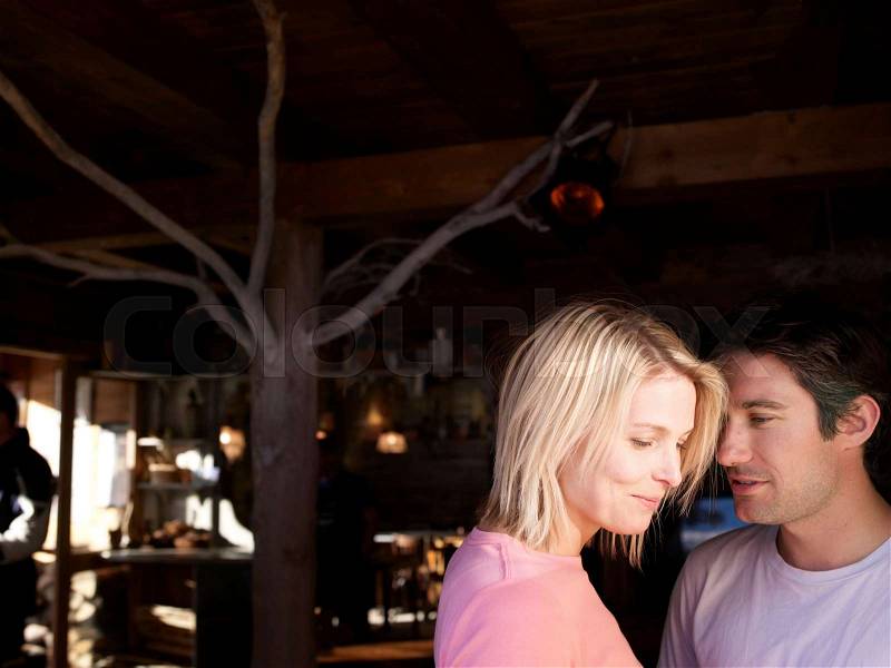 Man and woman talking in bar, stock photo
