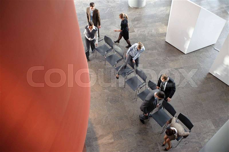 Group of business people with chairs, stock photo