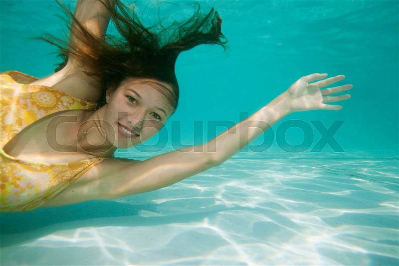 Portrait of girl underwater, stock photo