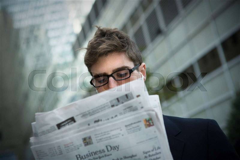 Man reading news paper, stock photo