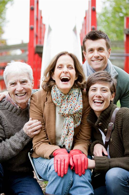 Family in the park laughing, stock photo