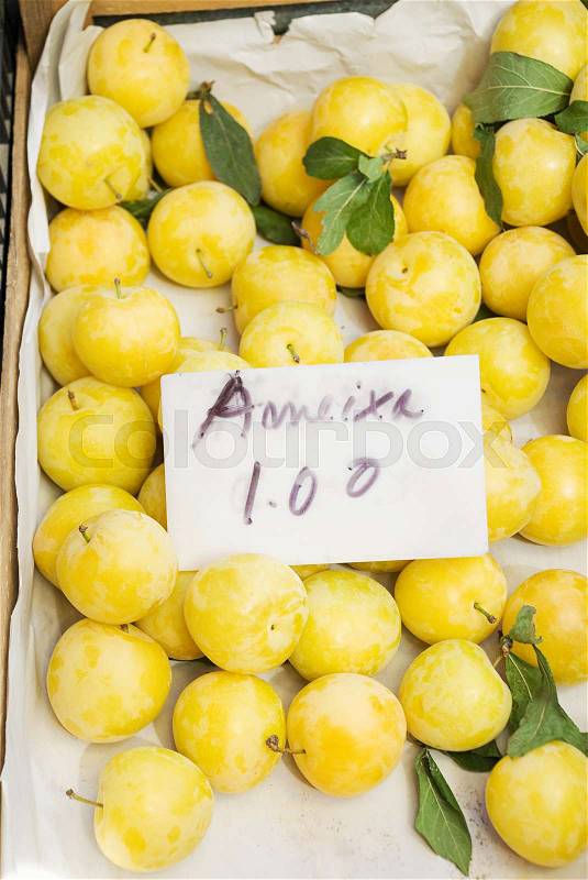 Plums on fruit stall, stock photo