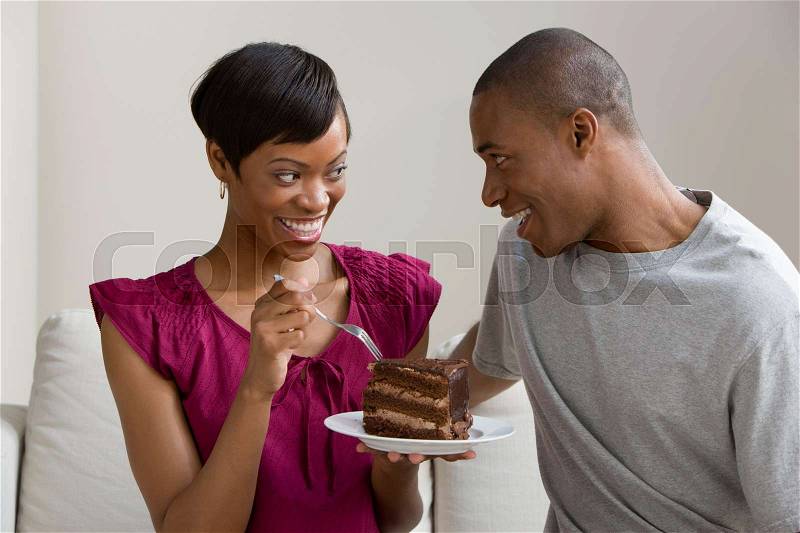 A couple sharing a cake , stock photo