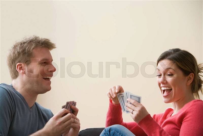 Couple playing cards, stock photo