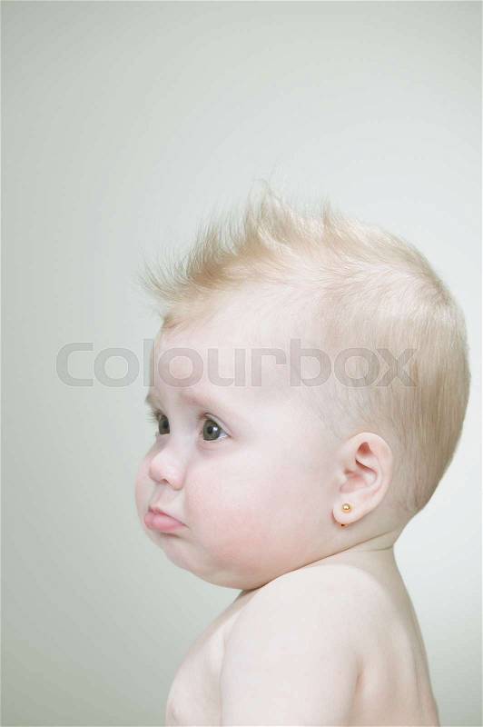 Baby girl with spiked hair, stock photo
