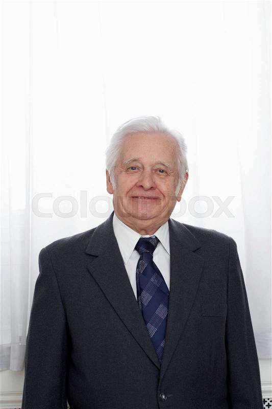 Senior Adult man in suit smiling, stock photo