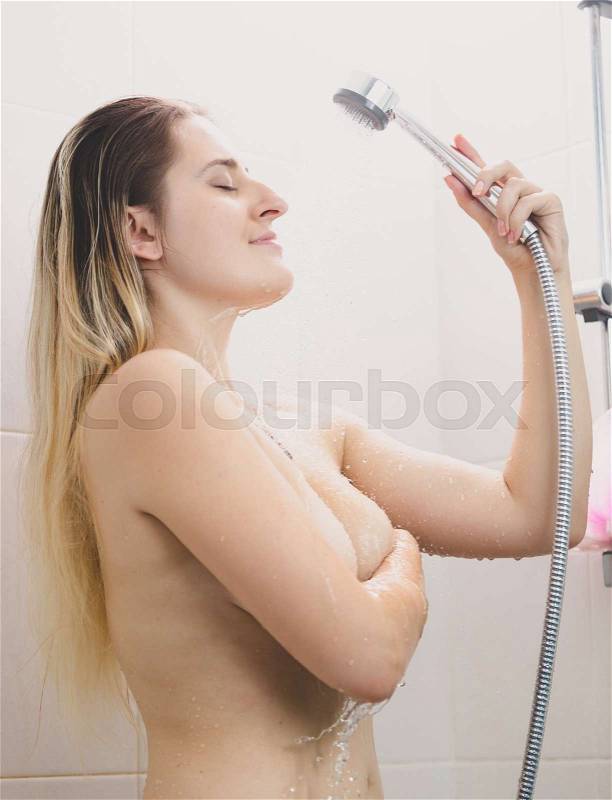 Portrait of sexy young woman with long hair washing, stock photo