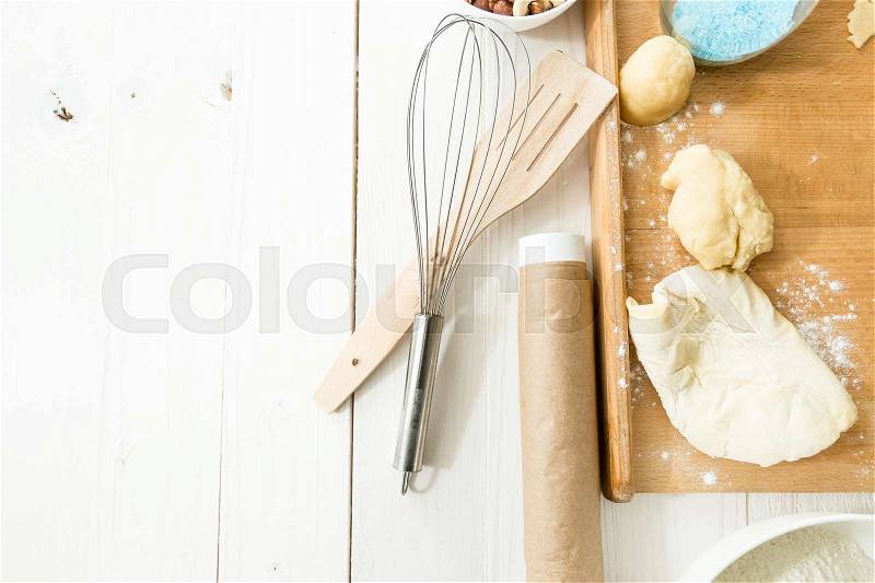 View from above on cookies on dish and kitchen utensils on table, stock photo