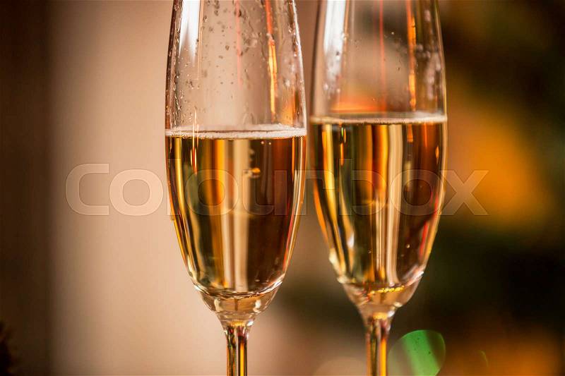 Macro image of champagne bubbles in two glasses, stock photo