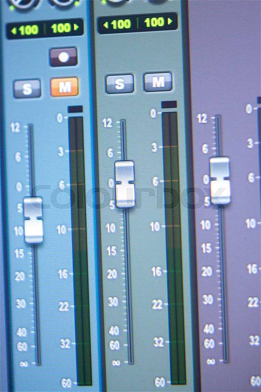 Recording audio, music, vocal and voiceover studio digital mixing desk controls to record tracks in Ibiza, stock photo