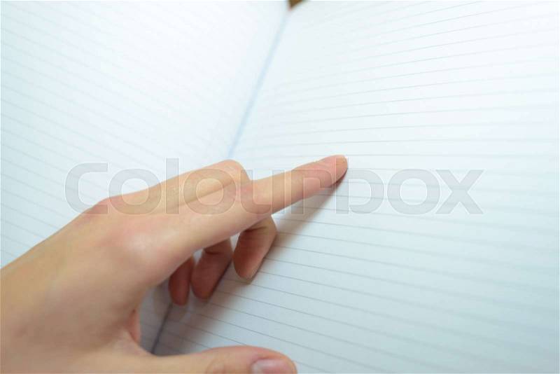 Notebook are hand pointing out line, stock photo