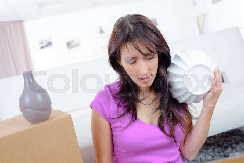 Woman fell down at home, stock photo