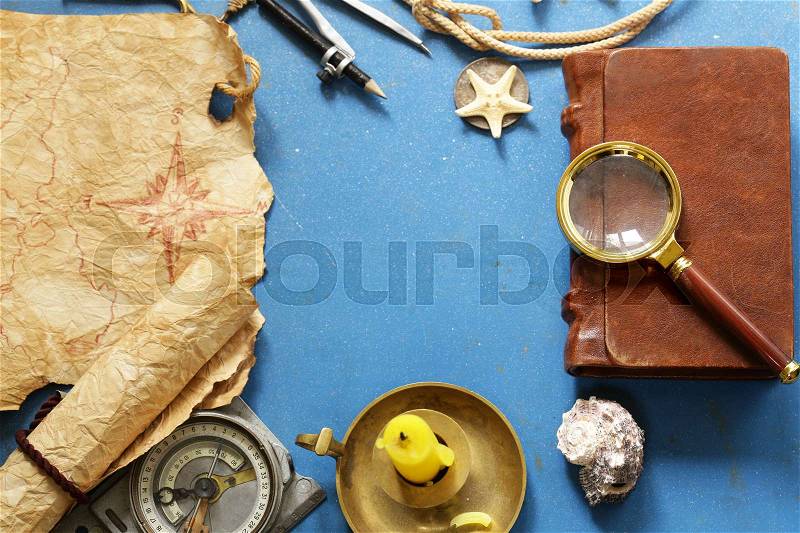 Vintage map, compass, magnifier - adventure and treasure hunt, stock photo