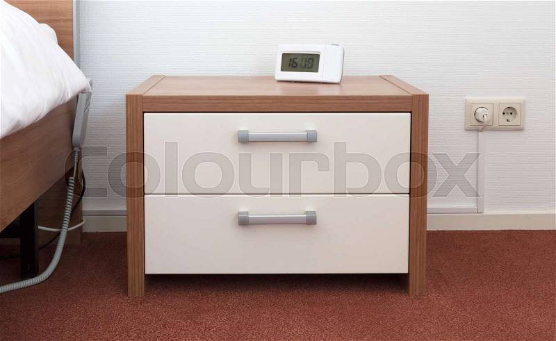 Bed and bedside table, modern design (wood), stock photo