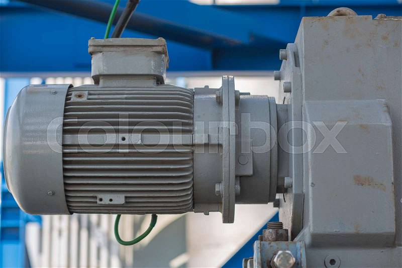 Induction motor with gear set in industrial factory, stock photo