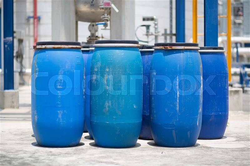 Blue Barrels storage drums in industrial factory, stock photo