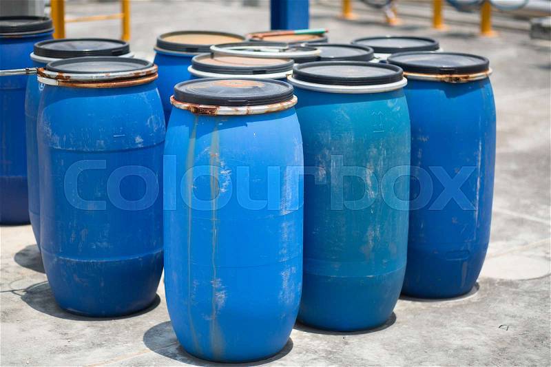Blue Barrels storage drums in industrial factory, stock photo