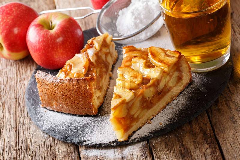 Two pieces of apple pie close-up on a table and apple juice. horizontal , stock photo