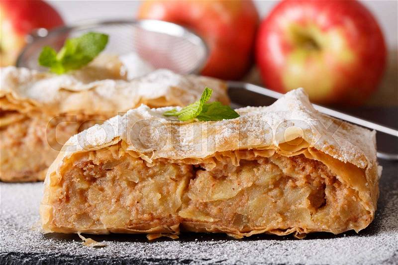 Traditional Austrian apple strudel close-up on the board. horizontal , stock photo