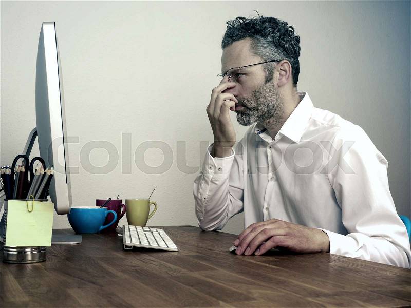 Overwork, deadline business concept, businessman typing on computer at night office, stock photo