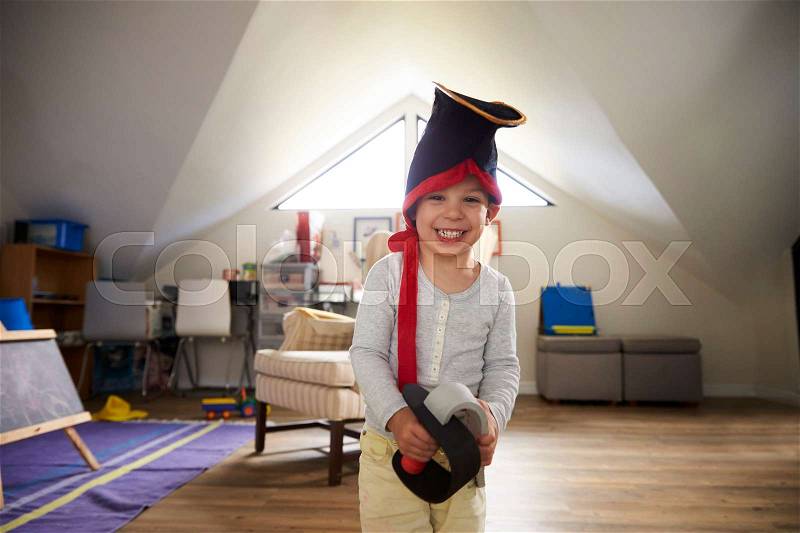 Portrait Of Boy Dressing Up As Pirate In Playroom, stock photo