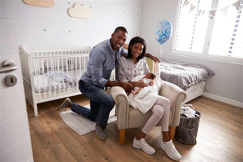 Portrait Of Parents Home from Hospital With Newborn Baby, stock photo
