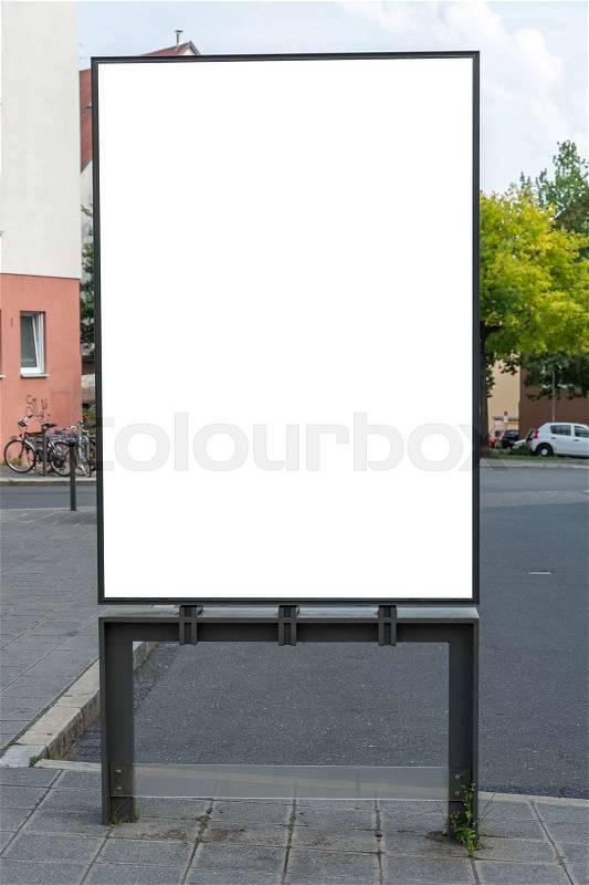 A blank ad space sign isolated in the street, stock photo