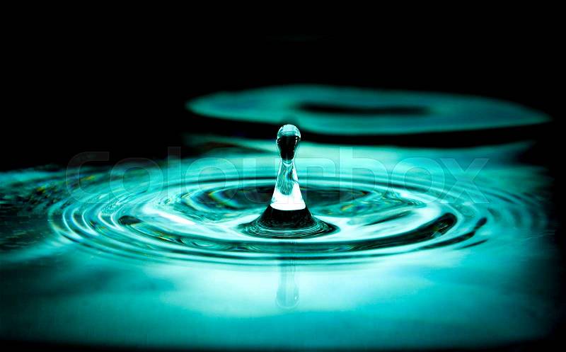 Impact of single water droplet, stock photo
