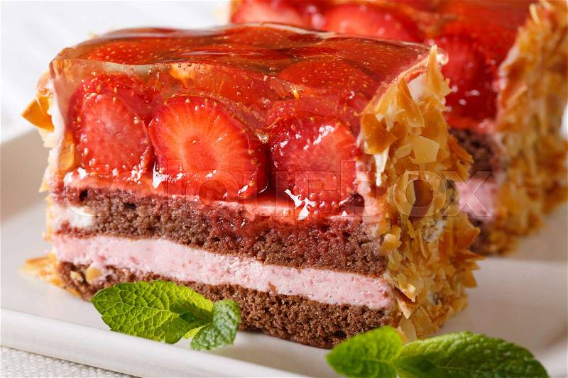 Freshly cooked strawberry chocolate cake with jelly macro on a plate on the table. horizontal , stock photo