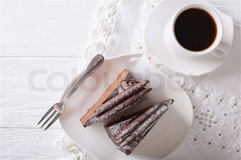 Chocolate truffle cake piece and coffee close-up on the table. horizontal view from above , stock photo