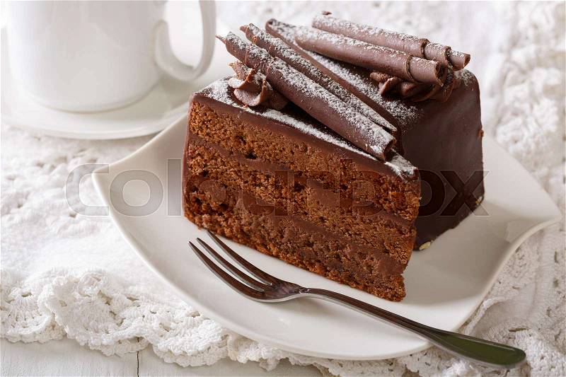 Truffle cake with chocolate decor on a plate close-up on a table. horizontal , stock photo