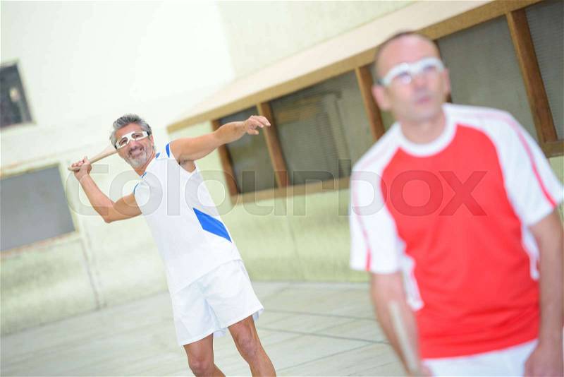 Active men on sports court, stock photo