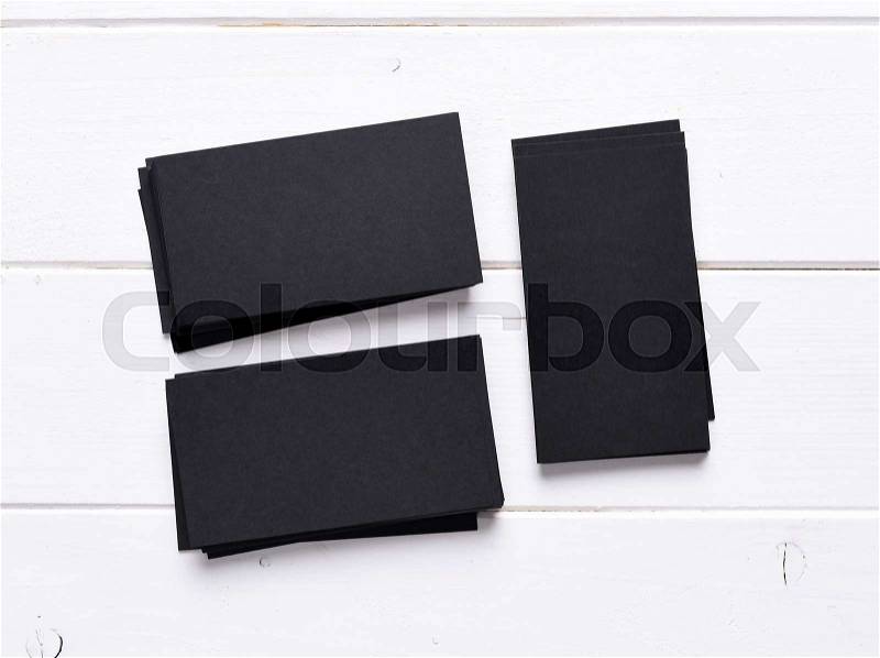 Horizontal and vertical stacks of black business cards, stock photo