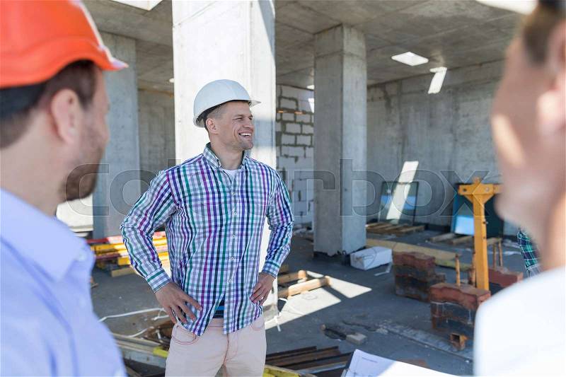 Buiders On Construction Site, People Building Business Concept Engineers Group On Working Object, stock photo